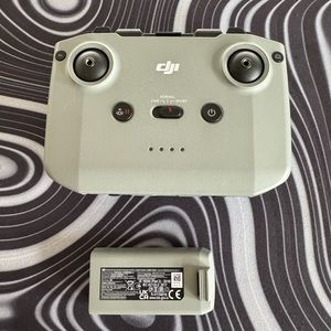 DJI remote controller with cables, DJI mini 2 battery.